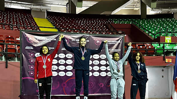Mia Ortiz-Martinez (far right) joins other wrestlers on the medal stand during the 45 kilo ceremony at the Pan American Games. She was a bronze medalist.